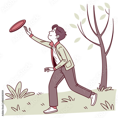 Young man catching frisbee in a park