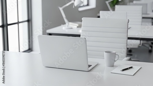Modern minimalist home office desk setup with white laptop computer coffee mug notepad and adjustable task lamp in bright workspace