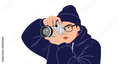 A person wearing a blue beanie and glasses takes a picture with a camera.