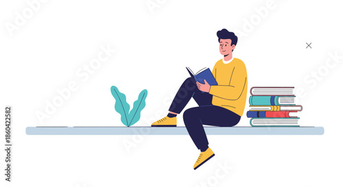 A man in a yellow sweater sits on a shelf and reads a book next to a stack of books and a plant.