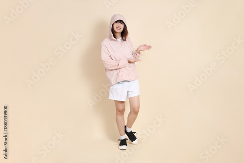 20s Asian woman in pink UV jacket