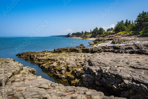 Rocky rugged coast of the Bay of Fundy at the Black Rock Lighthouse on the western side of Nova Scotis Canada