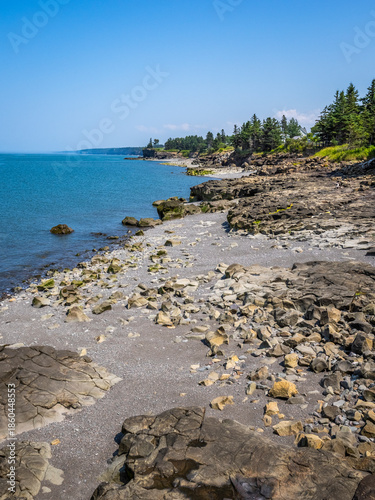 Rocky rugged coast of the Bay of Fundy at the Black Rock Lighthouse on the western side of Nova Scotis Canada