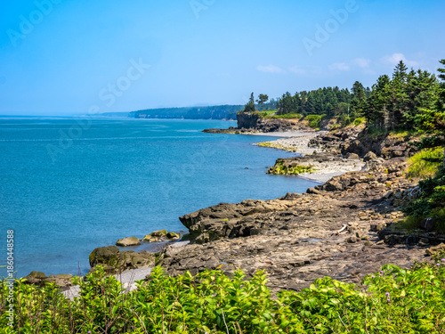 Rocky rugged coast of the Bay of Fundy at the Black Rock Lighthouse on the western side of Nova Scotis Canada