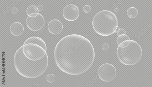 A set of various sized transparent soap or water bubbles with realistic reflections and highlights, isolated on a transparent checkered background.