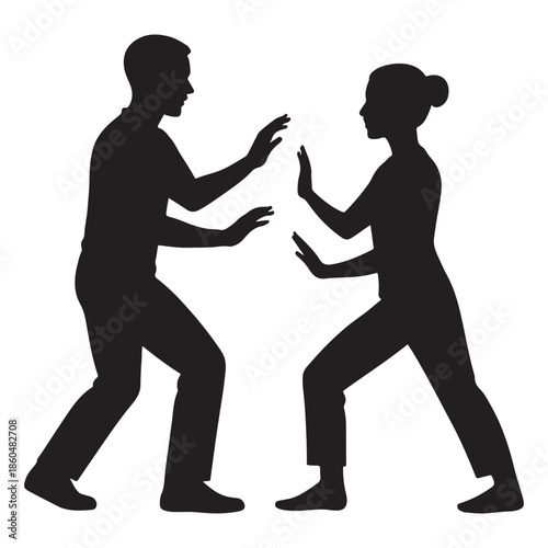 Silhouettes of a man and woman practicing martial arts in a balanced stance