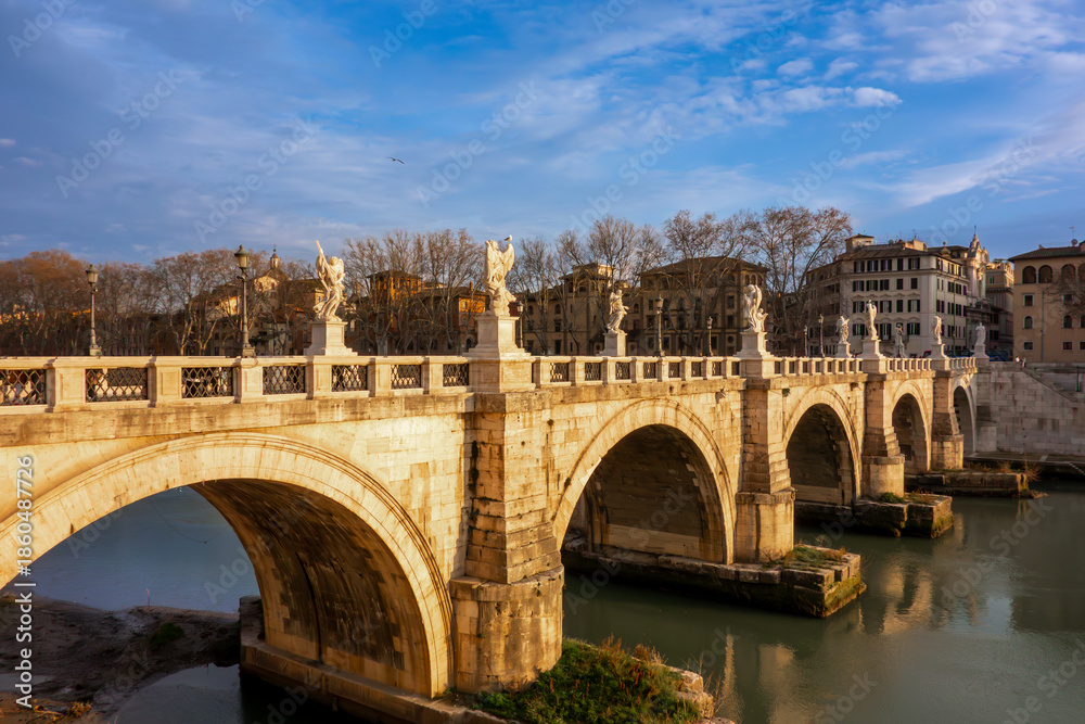 Obraz premium The iconic Ponte Sant'Angelo in Rome, Italy, The historic bridge and its famous angel statues crossing the Tiber River, a top European travel destination.