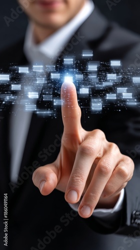 Close-up of a business professional's finger hovering over a futuristic digital interface with glowing elements and geometric shapes