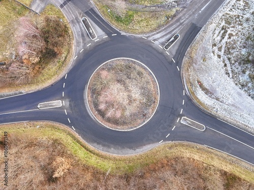 Aerial Drone View of a Circular Roundabout with Traffic in Winter Landscape