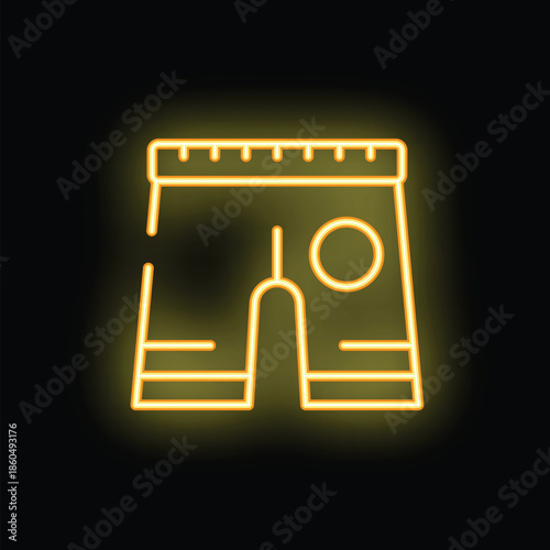 Bright yellow neon icon of shorts with measuring tape around waist on black background
