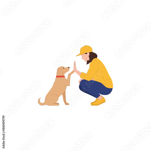 Woman in Yellow Jacket and Blue Pants Doing a High Five with a Friendly Golden Dog Sitting Down