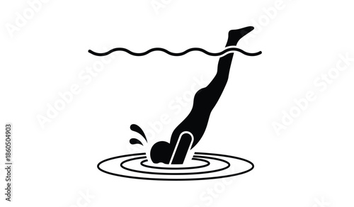 Silhouette of a diver entering water creating ripples and splashes