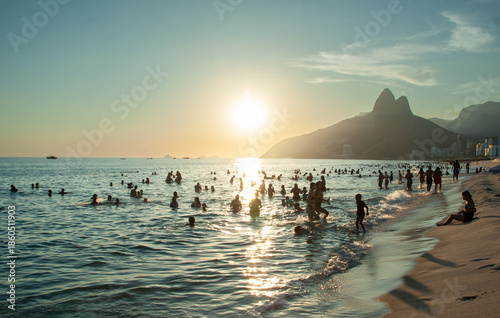 People enjoying Ipanema Beach during the summer in Rio de Janeiro.