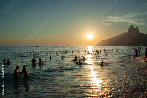 People enjoying Ipanema Beach during the summer in Rio de Janeiro.