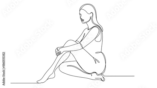Woman sitting on the floor with knees bent and hands on leg