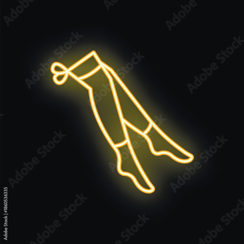 Bright yellow neon sign showing a pair of women's stockings with a bow on a black background