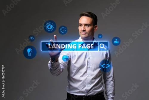 Business, Technology, Internet and network concept. Young businessman working on a virtual screen of the future and sees the inscription Landing page.