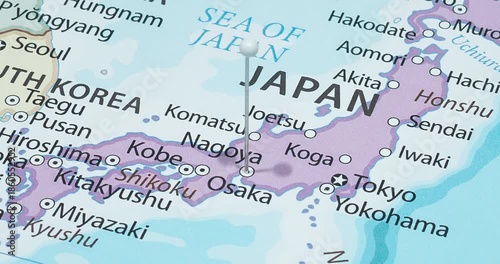 A zoom out of a white pin into nagoya city of japan political map