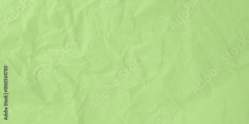 Abstract light green crumpled paper texture background