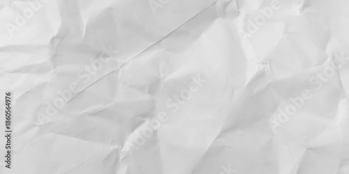 
​White crumpled paper texture background. Abstract, distressed, and wrinkled surface for a simple, minimal backdrop or overlay. 