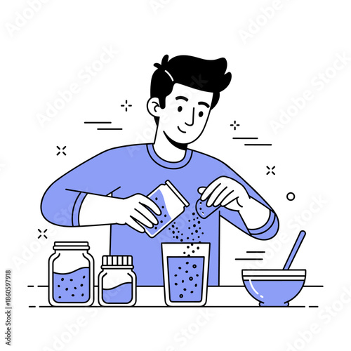 Young male preparing a drink in the kitchen with ingredients and kitchenware