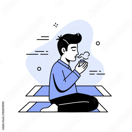 Young asian male meditating and enjoying tea in calming zen moment