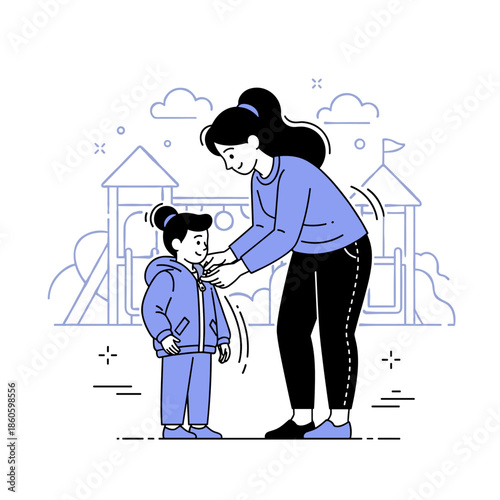 Asian female adult dressing young asian female child in playground