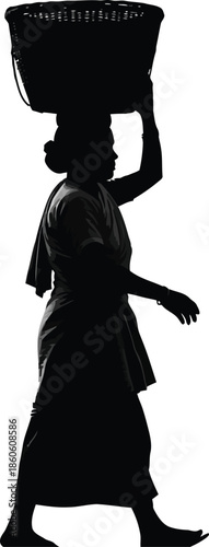 A woman carries a basket on her head in a serene and peaceful atmosphere.