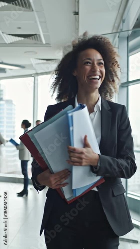 business man and woman walking and talking in the office