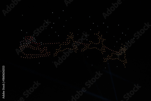 Santa Claus and Reindeer Sleigh Image Created by UAV Drone Light Show with Soft Focus and Minimal Bokeh Effect