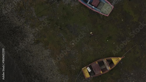 Aerial Overhead View of Colorful Fishing Boats Beached on Bay Shore