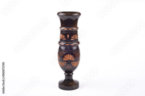 Handcrafted vintage black carved wooden vase isolated on the white background