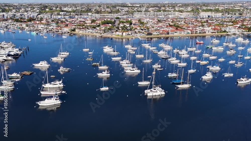 Aerial footage of boats and yachts in the Newport Bay in Newport Beach California USA