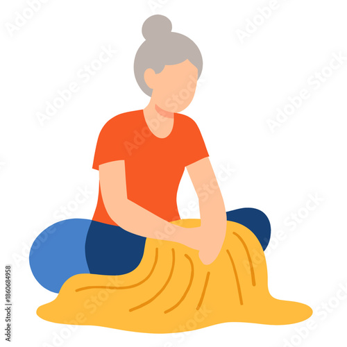 Senior woman kneading dough while sitting on the floor in home kitchen . Elderly set