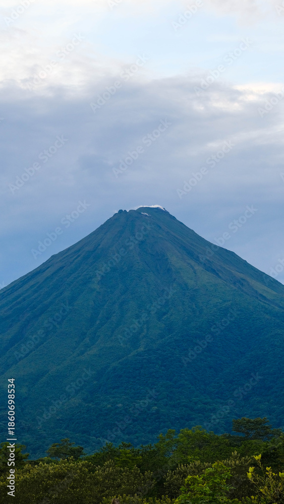 Fototapeta premium Clear View of a Majestic Arenal Volcano Seen from Monteverde in the Tropical Highlands of Costa Rica