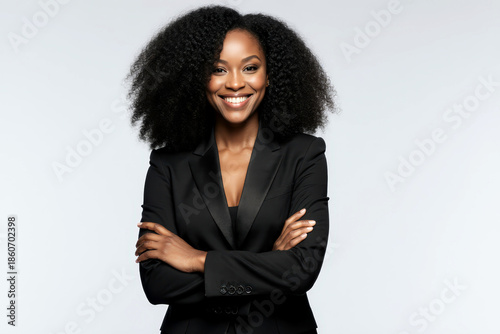 Portrait of beautiful positive african american woman standing with arms crossed