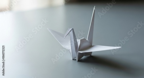 Origami paper crane with delicate wings, a symbol of peace and good fortune, crafted with precision and elegance