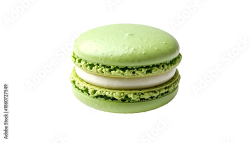 Isolated light green macaron with creamy filling, against a black background