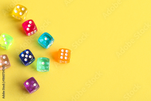 Colorful game dices on yell...