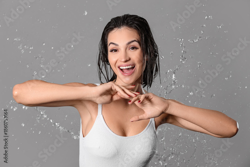Happy young woman with wate...