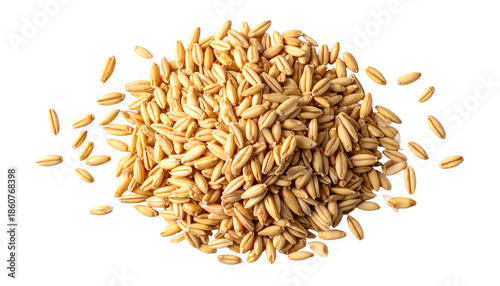 Overhead view of a pile of golden oat groats on a stark black background