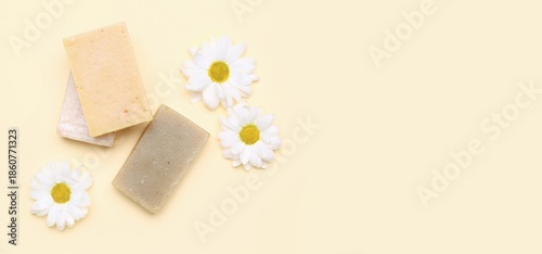 Soap bars and chamomiles on...
