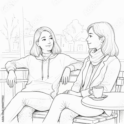 Two young women friends talking and smiling at a cafe, sitting on a bench