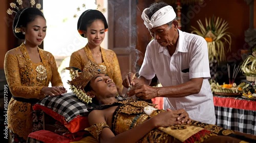 Balinese Hindu Priest Performing a Sacred Mepandes Ceremony for a Young Man.