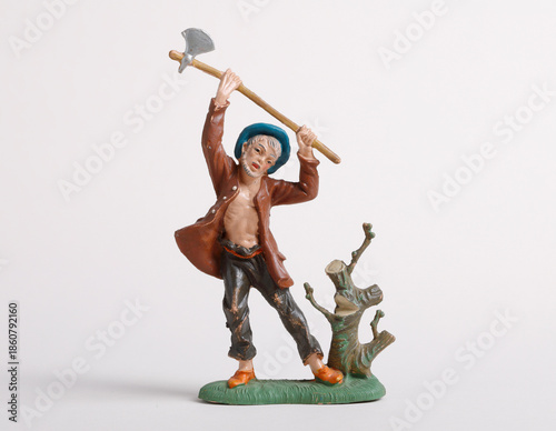 Lumberjack figurine with axe on white background