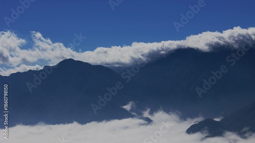 Low Clouds Drifting Across Mountain Ridge 