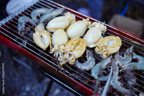 Grilled shrimp and grilled squid on the stove, Street food, Thailand