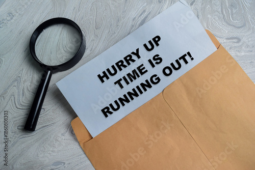 Vászonkép hurry up time is running out text on document above brown envelope
