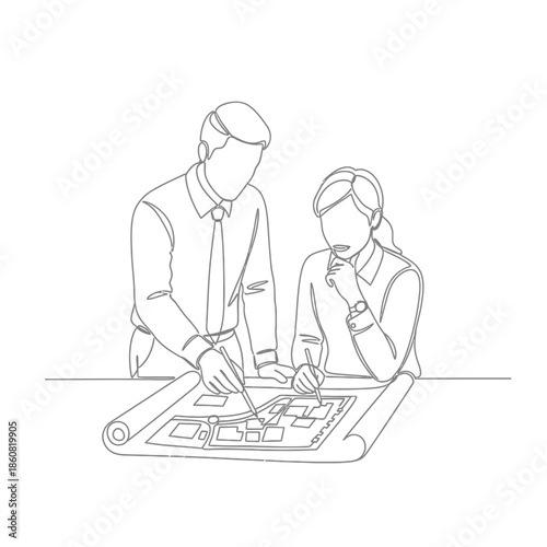 Business partners discussing architectural blueprint together.