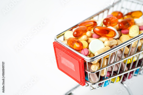 Shopping cart full of medicines, pills, drugs, vitamins, health shopping concept